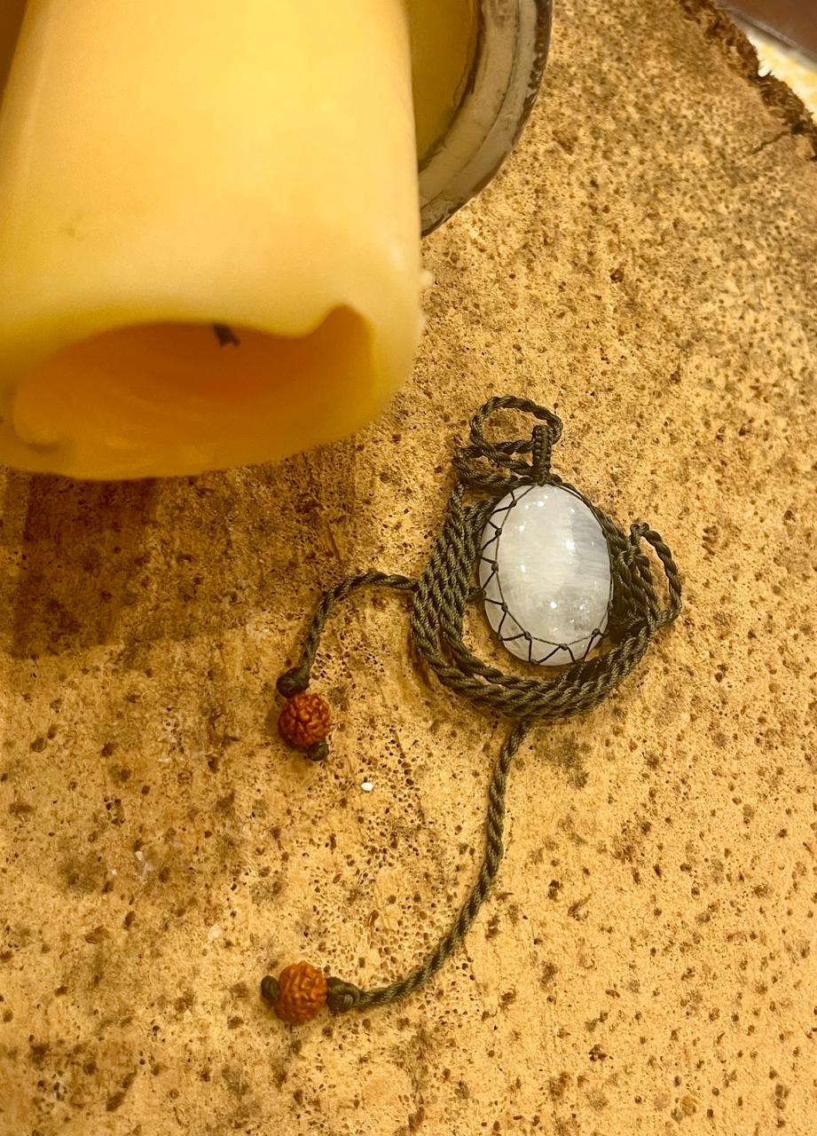 Season Stones moonstone pendant with a macrame cord, showcasing a smooth, polished moonstone gemstone on a natural woven necklace.