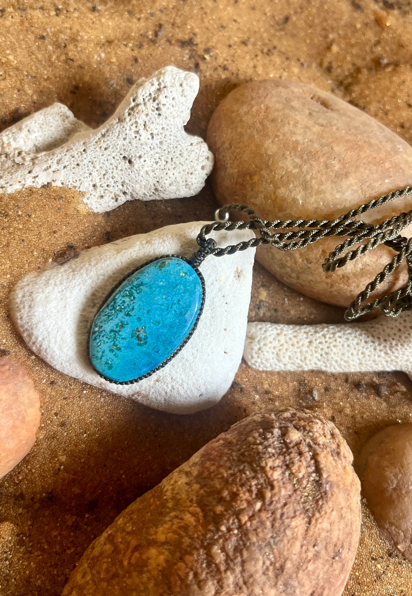 Turquoise pendant made with macrame cord featuring rare stone details, crafted by Season Stones.