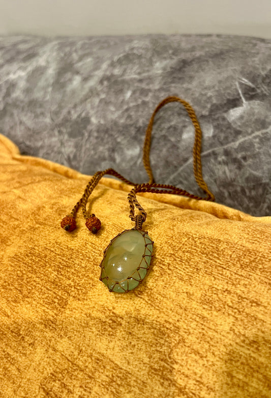 Prehnite stone in macrame cord necklace from Season Stones featuring a polished green Prehnite pendant on hand-woven cord